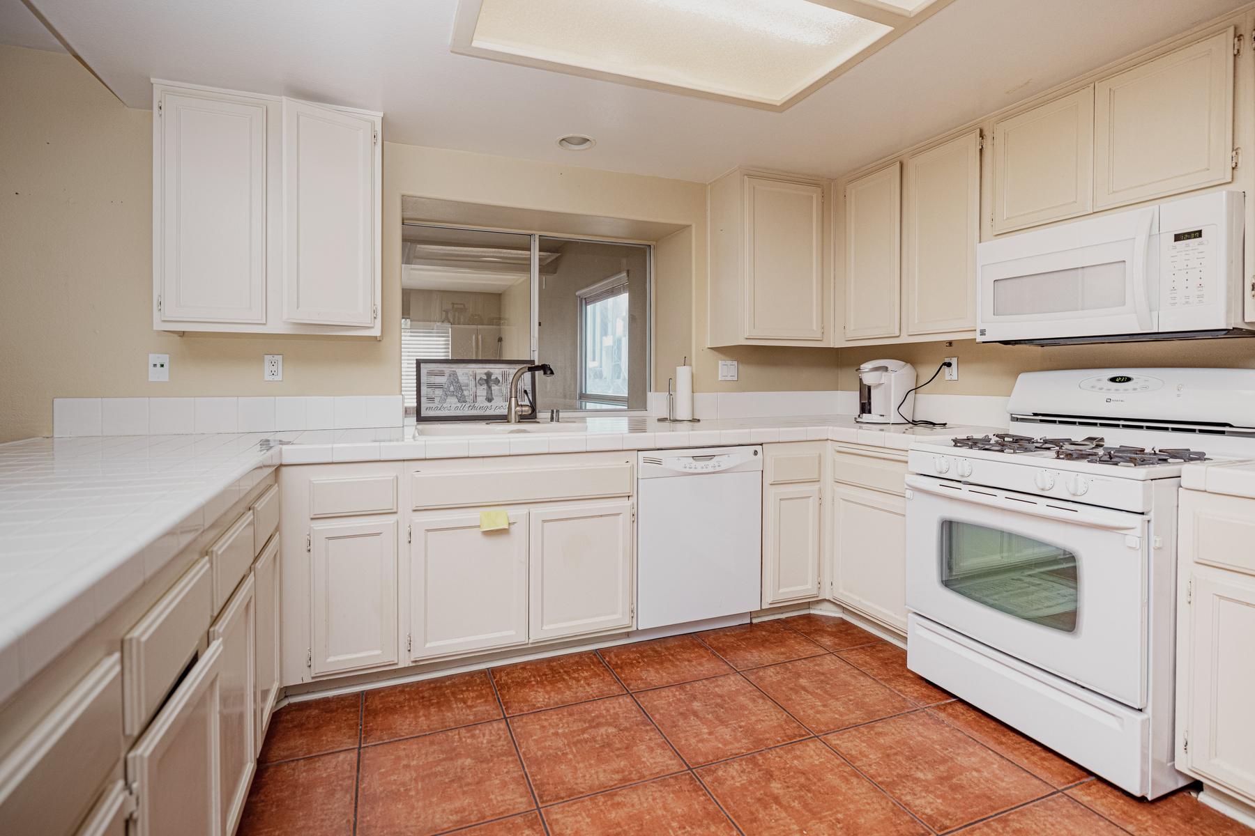 Full kitchen with gas range, oven and dishwasher