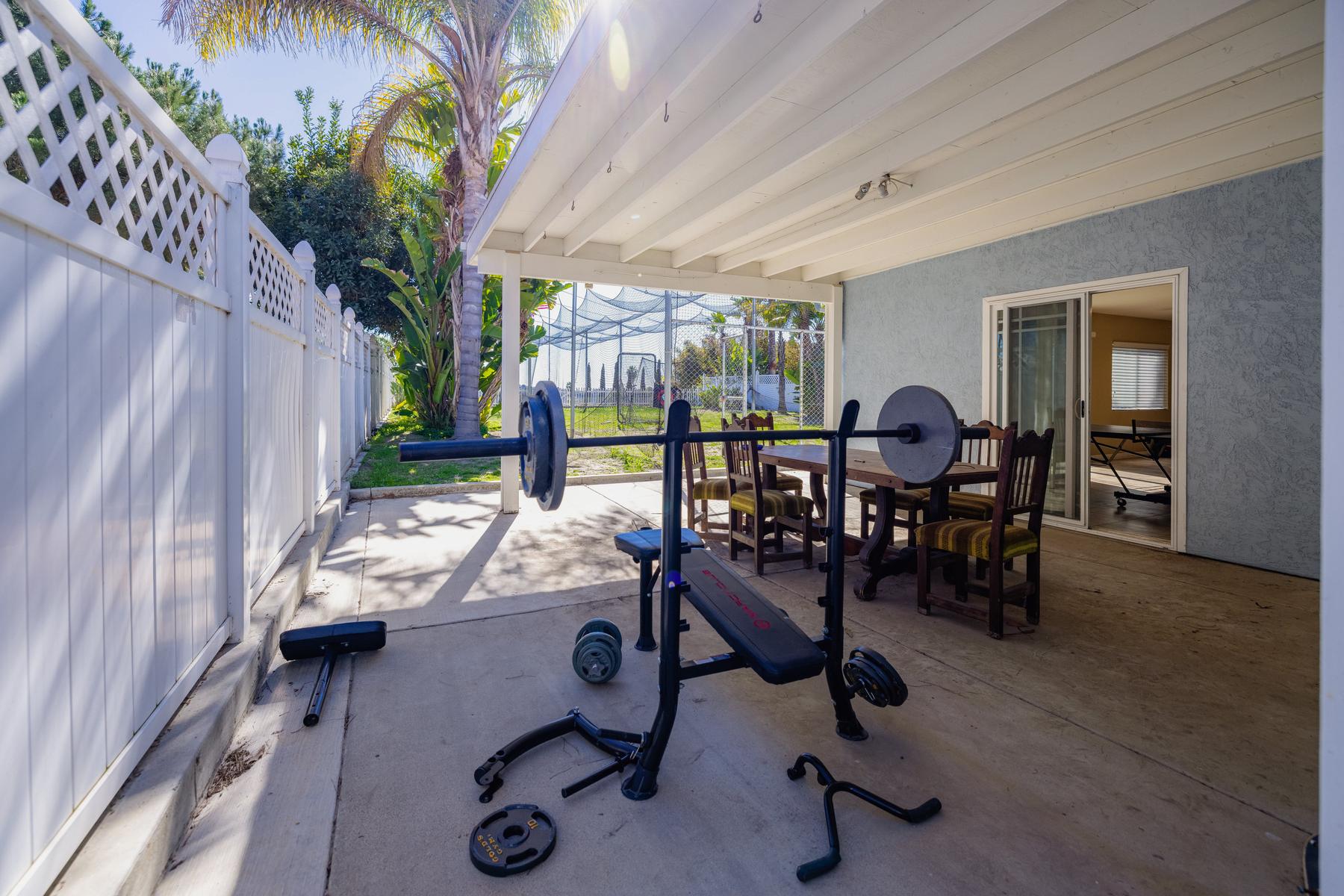 Covered patio and weight bench